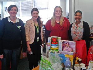 Pregnancy Outreach Worker Caroline (second from right) with Asda's Community Life Champion Judah (right) and other Asda staff